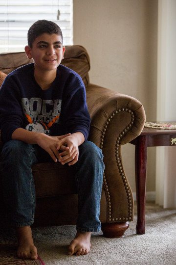 Omran Barakat, now 11, was seven years old when mortars rained on his neighbor's home in Homs, Syria. he and his family have since fled to Dallas, and their own home has been destroyed.