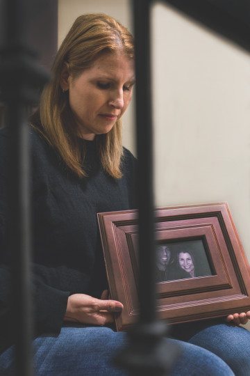 Lisa Aimone with a photo taken in 2010 of her and her husband, Ziad Abu Naim, who was killed in June 2015 during a traffic dispute. His killer was never indicted, as part of Texas' Stand Your Ground law.