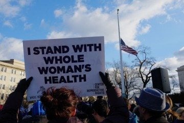 Protesters gather outside the U.S. Supreme Court as judges consider oral arguments in the Texas House Bill 2 abortion case, Whole Woman's Health v. Hellerstedt.