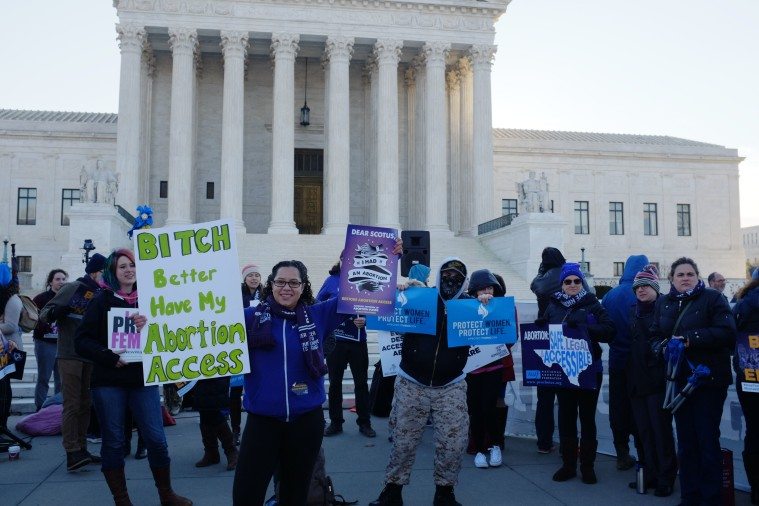 Protesters gather outside the U.S. Supreme Court as judges consider oral arguments in the Texas House Bill 2 abortion case, Whole Woman's Health v. Hellerstedt.