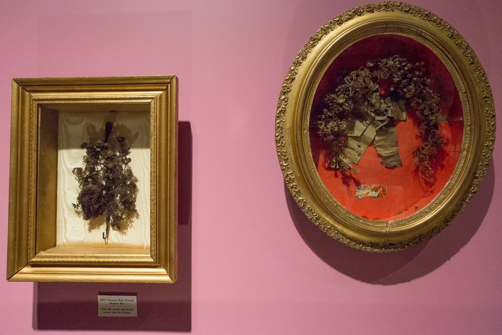 Lightboxes filled with decorations made from human hair of the deceased, on display in the "19th Century Mourning" exhibit at the National Museum of Funeral History in Houston.