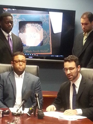 Pastor Jordan Brown, bottom left, says that the Whole Foods bakery sold him a cake with a gay slur written on it in icing.