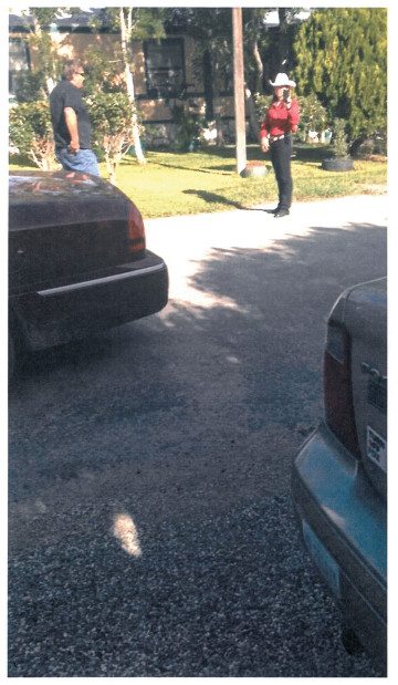 Elliott filming attendees outside a meeting of the Democratic Party's executive committee in Rocksprings in August 2014.