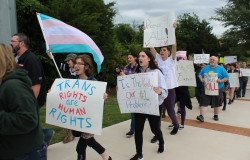 About 100 LGBT Texans, supporters and allies marched outside Rockwall City Hall Monday night to protest the mayor's proposal to criminalize some trans people for using public restrooms. Bathroom ordinance
