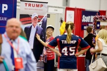 A Donald Trump supporter with a photo of the man