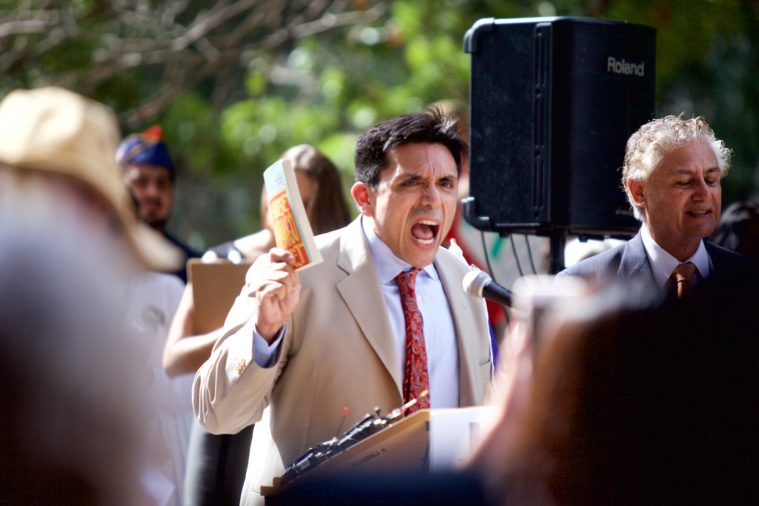 Houston activist and author Tony Diaz speaks at a rally against the textbook