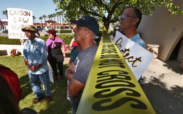 Jim Orey, 55, left next to crime scene tape, and John Blackman, 61, among a group of convicted sex offenders gathered at Carson city hall for a march on Saturday to demand equal rights to visit fast-food restaurants, parks, libraries and other public areas from which they are now banned. The protest is timed to coincide with the date of Martin Luther King Jr.'s voting-rights march to Selma, Ala., 50 years ago to emphasize that the issue is about a denial of constitutionally protected human rights. Carson imposes the state's harshest restrictions against registered sex offenders. Registered citizens, family members, and all who support them joined the march was organized by California RSOL - California Reform Sex Offender Laws. (Photo by Irfan Khan/Los Angeles Times via Getty Images)