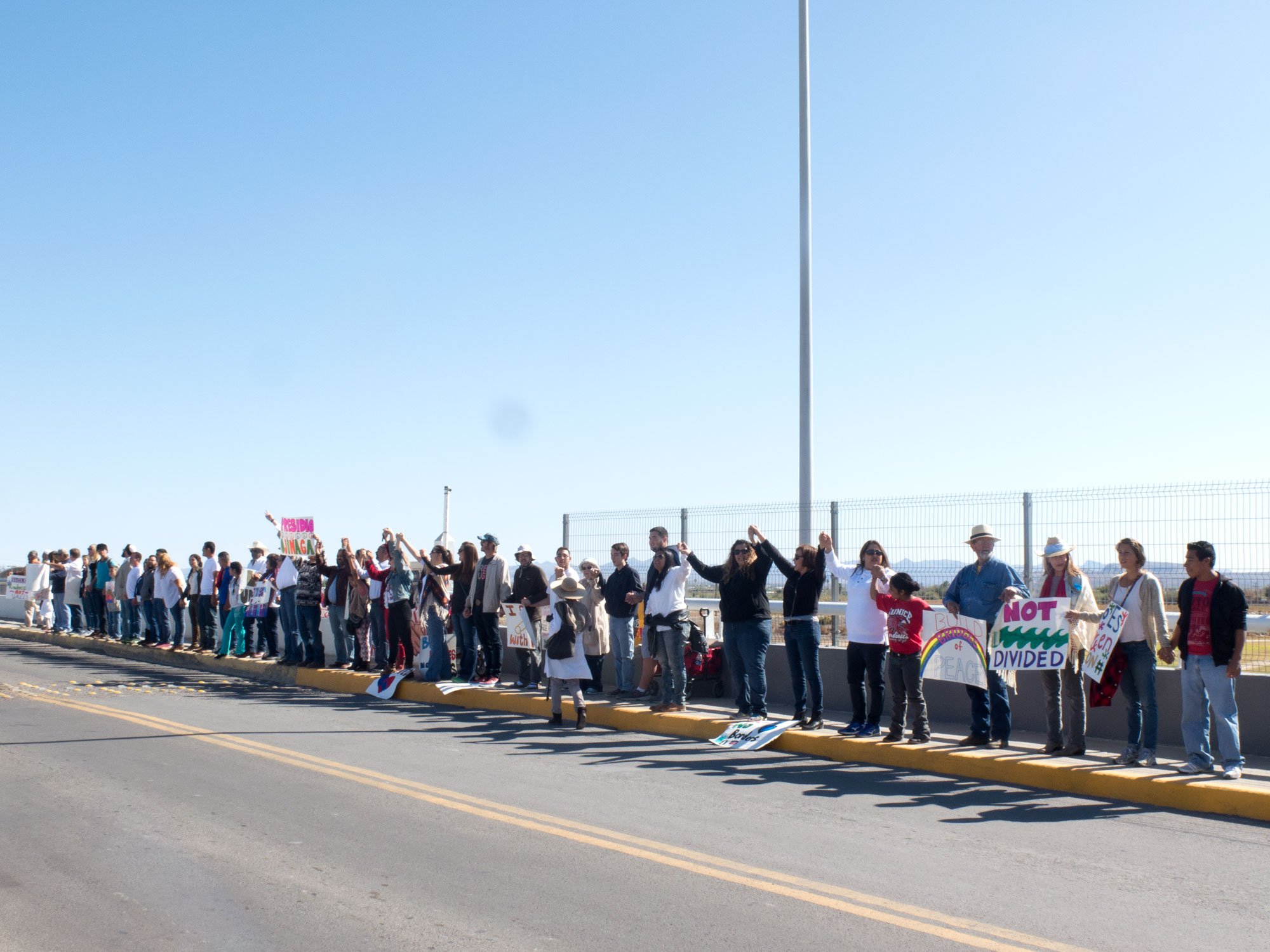 West Texans and Ojinaga, Mexico residents hold hands across the international bridge in a show of mutual solidarity.