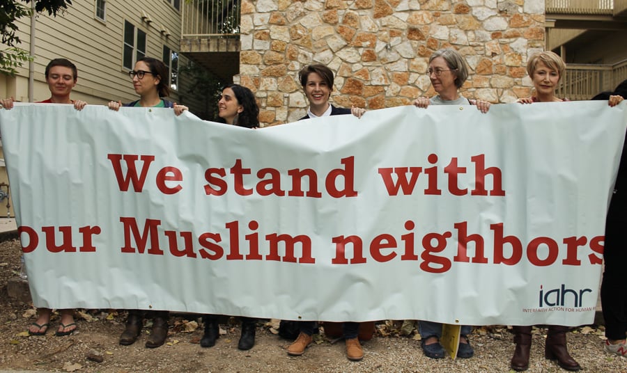 Demonstrators hold banner