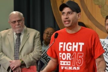 Ruben Alvarado, 33, speaks about the importance of raising the minimum wage during a press conference Thursday. Until recently, Alvarado worked at Popeye's, earning minimum wage. 