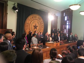 Texas Democrats huddle after Governor Greg Abbott's State of the State address.