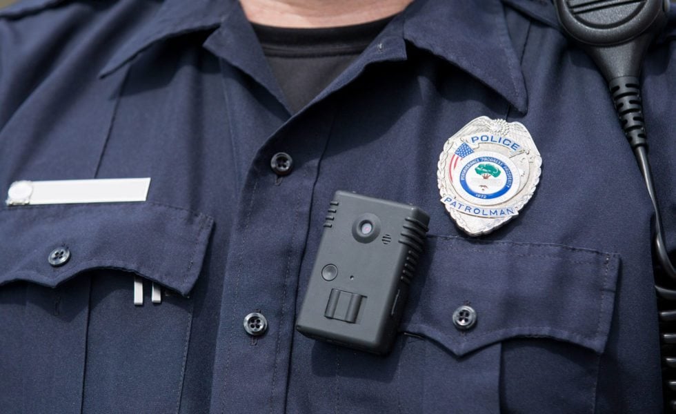 A police officer wearing a body camera.