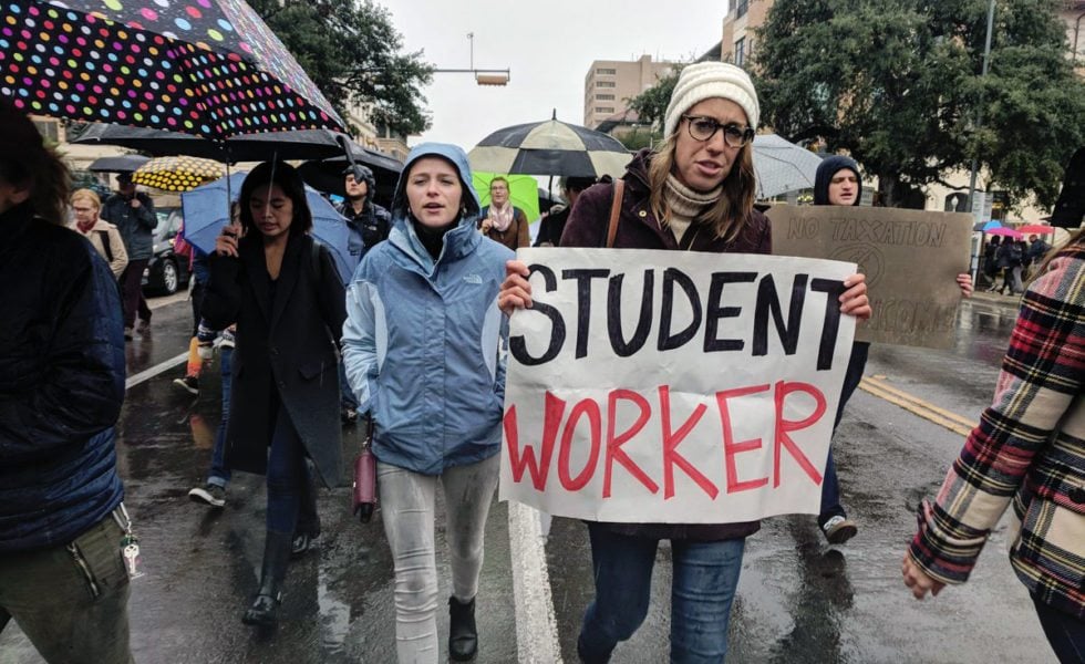 Graduate students marched through the UT-Austin campus Wednesday.
