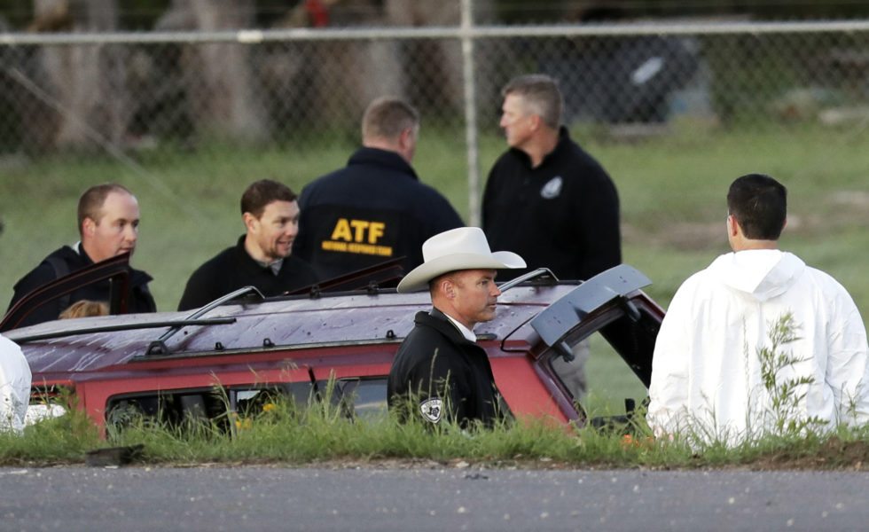 Officials investigate the scene where a suspect in a series of bombing attacks in Austin blew himself up as authorities closed in, Wednesday, March 21, 2018, in Round Rock, Texas.