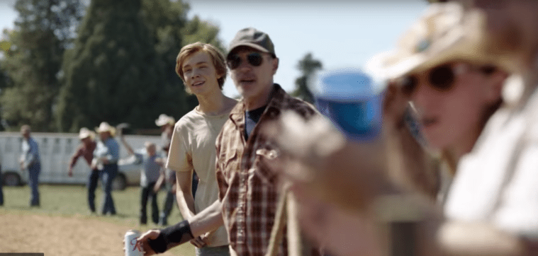 Charley (Charlie Plummer) and Del, a horse trainer played by Steve Buscemi, at the racetrack.