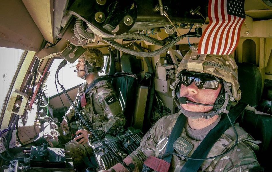 Air Force Staff Sergeant Logan Ireland, right, during a deployment to Afghanistan.