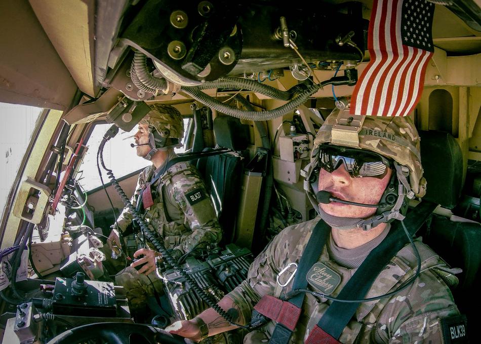 Air Force Staff Sergeant Logan Ireland, right, during a deployment to Afghanistan