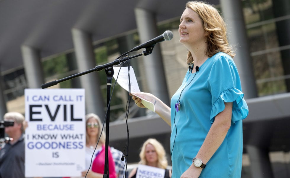 Rape survivor and abuse victim advocate Mary DeMuth speaks during a rally protesting the Southern Baptist Convention's treatment of women outside the convention's annual meeting in Dallas.