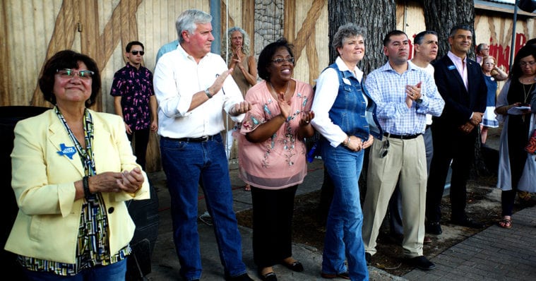 Candidates on the Texas Democratic Party's statewide slate — from left to right, gubernatorial nominee Lupe Valdez, lieutenant governor nominee Mike Collier, comptroller nominee Joi Chevalier, agriculture commissioner nominee Kim Olson, land commissioner candidate Miguel Suazo, and railroad commissioner nominee Roman McAllen — watch as attorney general nominee Justin Nelson speaks at a fundraising event in Austin.