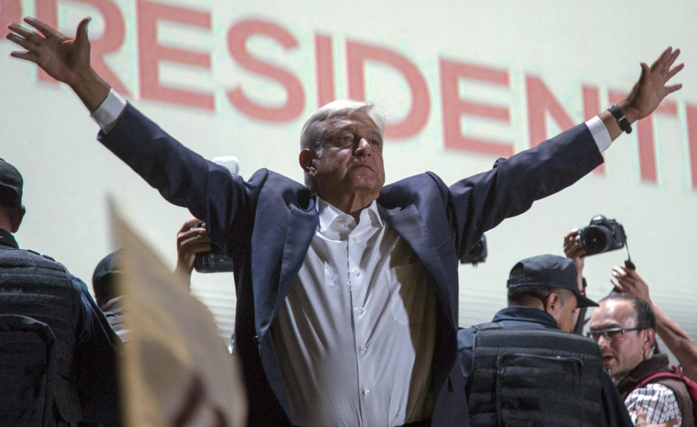 Presidential candidate Andres Manuel Lopez Obrador acknowledges his supporters as he arrives to Mexico City's main square, the Zocalo, after claiming victory in the election.