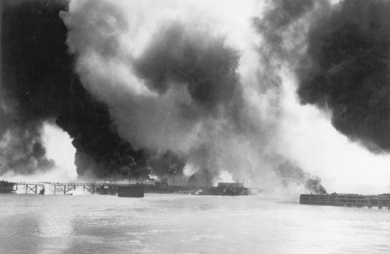 Burning storage tanks and raised pipelines at the port after the 1947 Texas City Disaster.