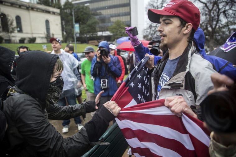 Counter-protesters clash with supporters of President Trump in Austin during a
