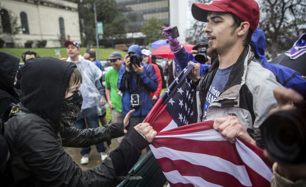 Counter-protesters clash with supporters of President Trump in Austin during a