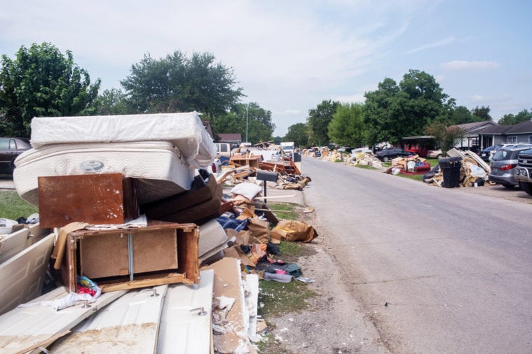 Debris piled up outside homes in Houston after Hurricane Harvey.
