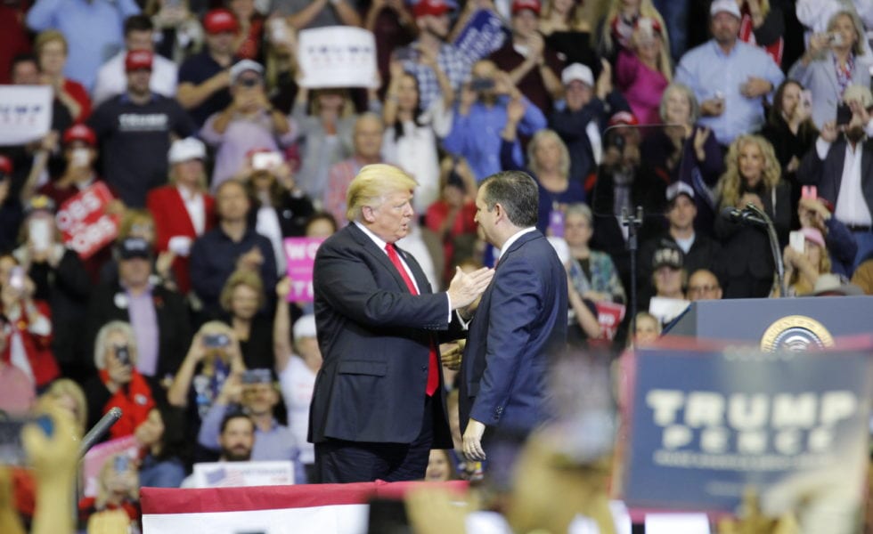 Donald Trump and Ted Cruz have a brief tête-à-tête at the MAGA rally in Houston in October 2018.