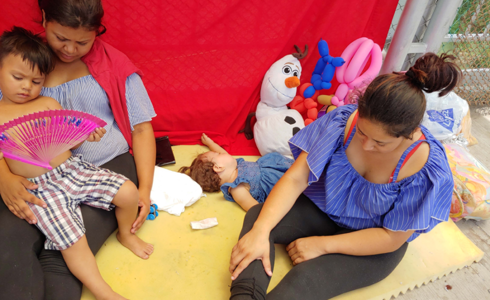 Asylum-seekers waiting on one of the international bridges connecting Texas and Mexico.