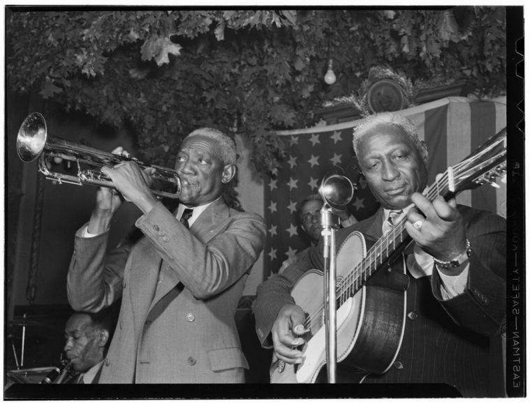 Lead Belly (right) plays with Bunk Johnson in 1946.