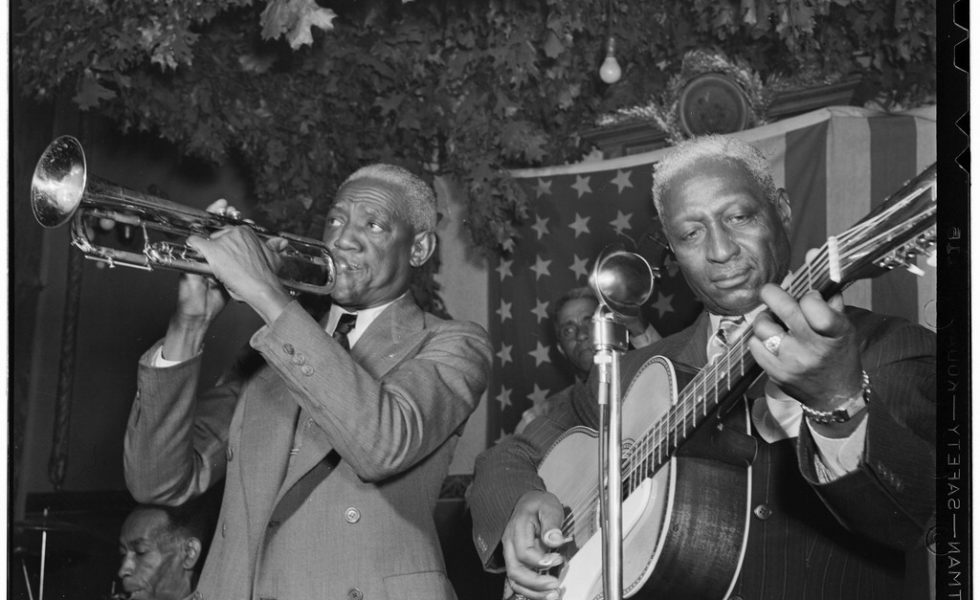 Lead Belly (right) plays with Bunk Johnson in 1946.