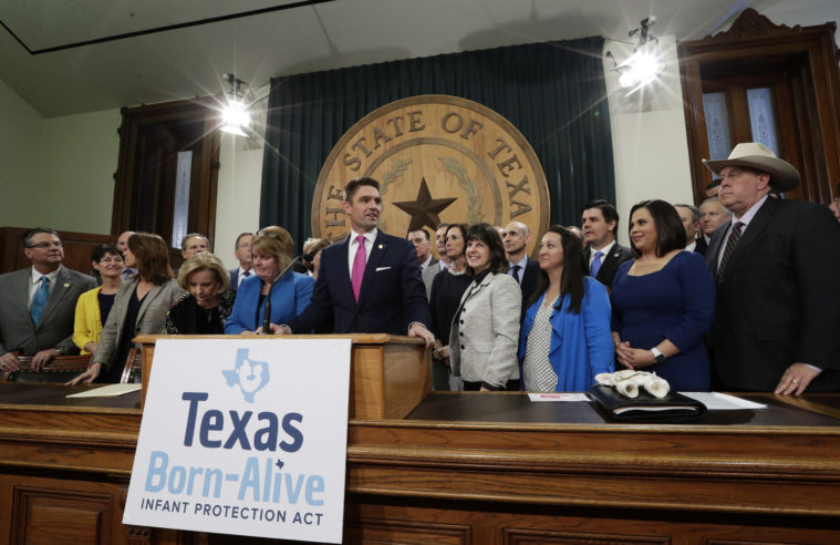 State Representative Jeff Leach, at podium, stands with fellow lawmakers and guests to talk about the Texas Born-Alive bill, Thursday, March 7, 2019, in Austin, Texas.