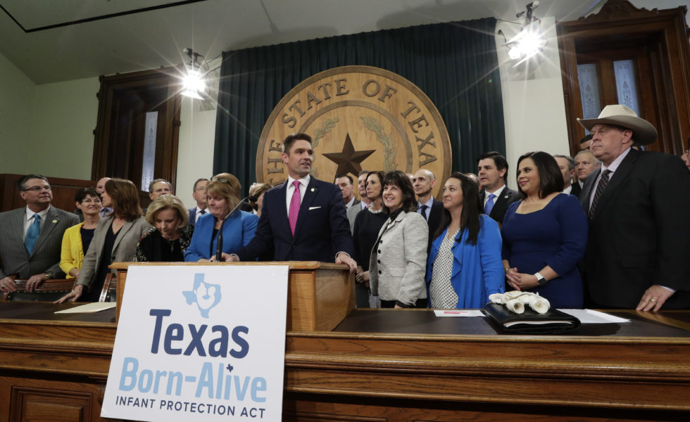 State Representative Jeff Leach, at podium, stands with fellow lawmakers and guests to talk about the Texas Born-Alive bill, Thursday, March 7, 2019, in Austin, Texas.