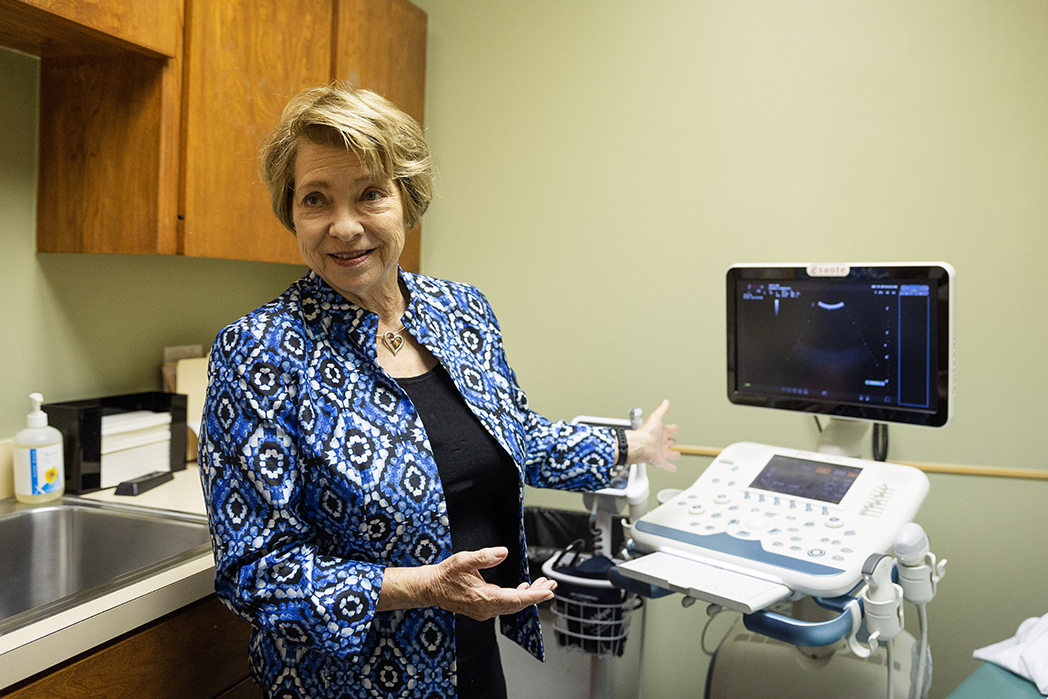 Carol Everett shows her clinic’s ultrasound machine, which she calls “a blessing.”