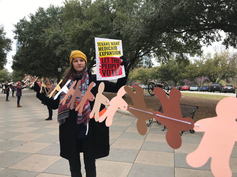 Texans rally for Medicaid expansion at the Capitol in March. The paper cutouts represent uninsured Texans who would be eligible for coverage under Medicaid expansion.