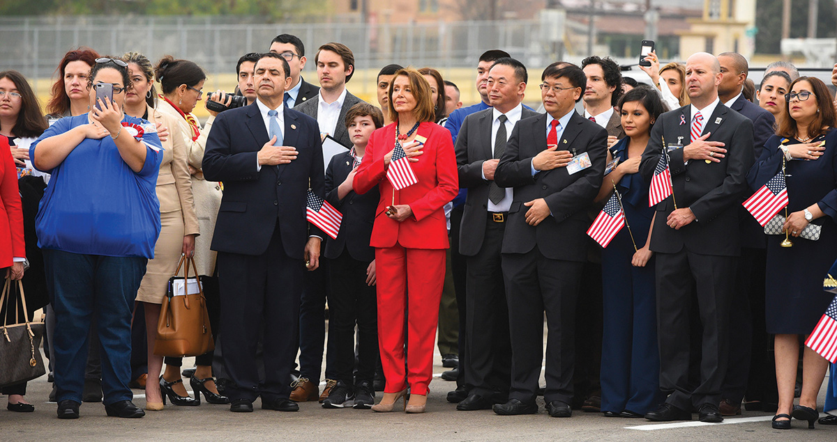 Guests and dignitaries listen to the U.S. national anthem on the Juarez-Lincoln International Bridge