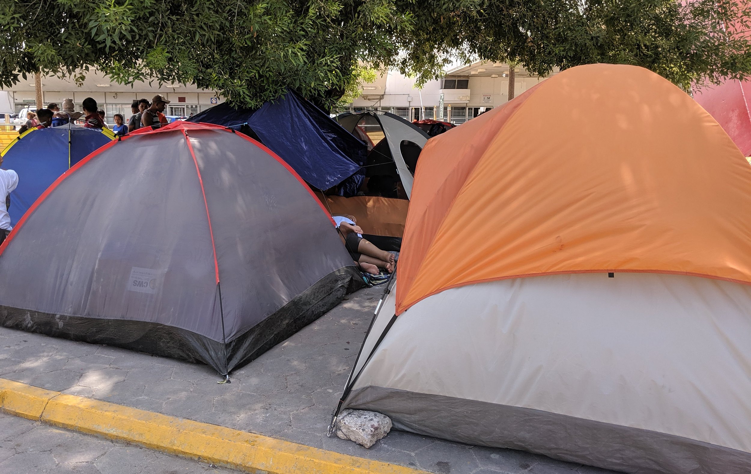 A migrant encampment by international bridge in Matamoros.