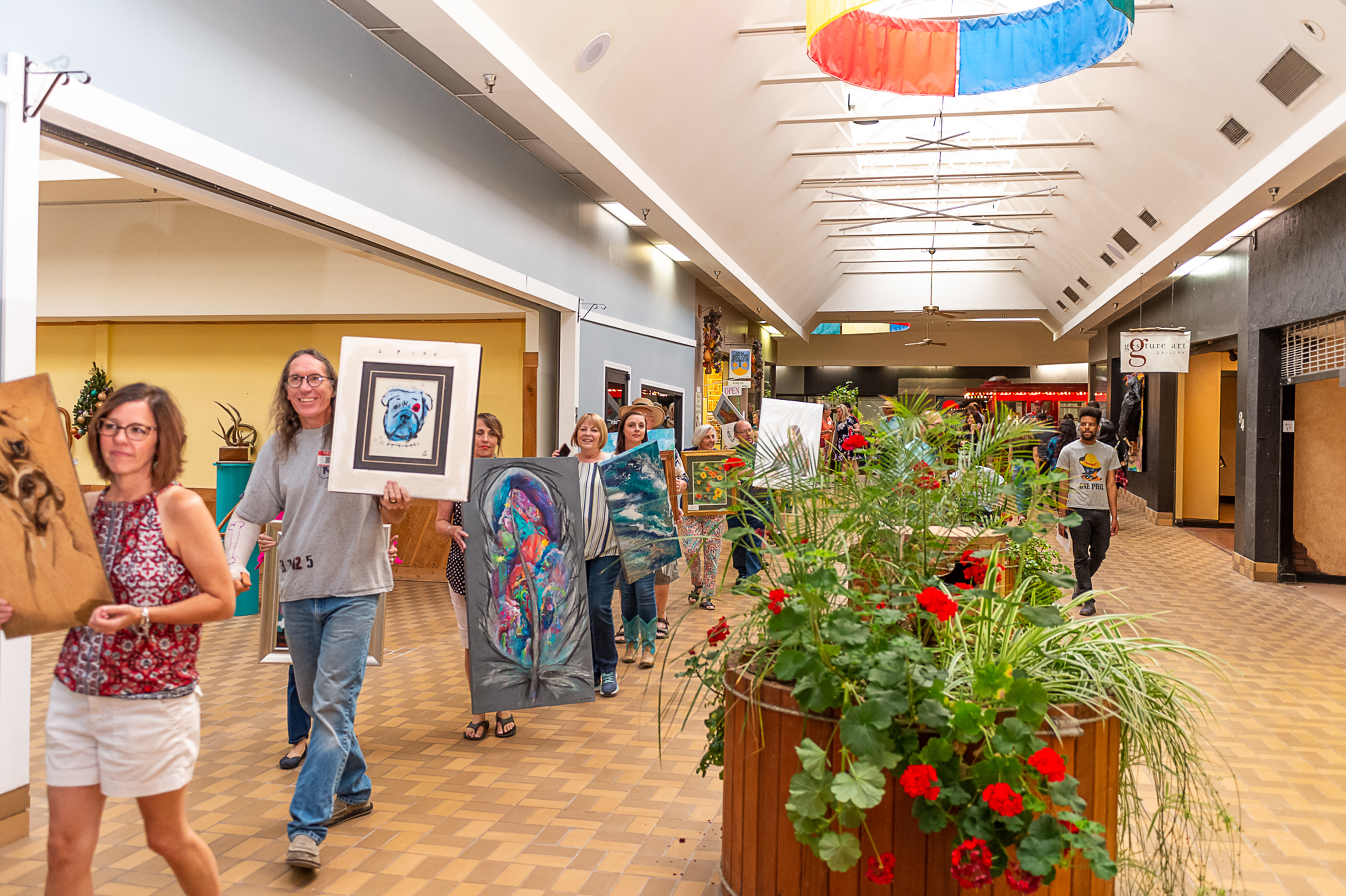 Artists and visitors parade down the halls of the Sunset Center on August 2.