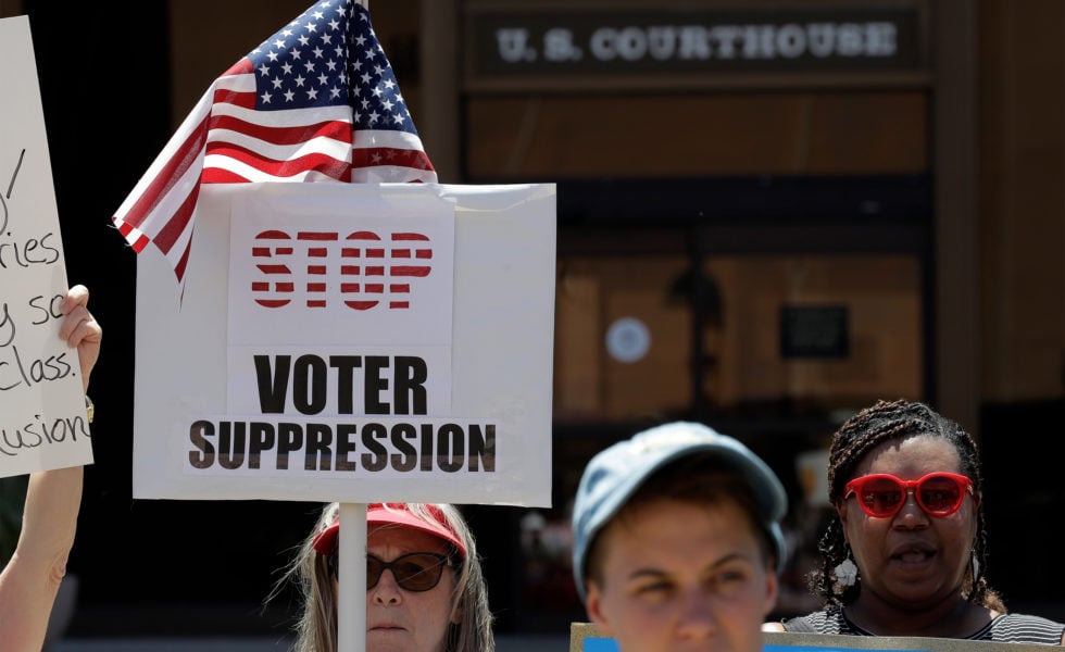 Protesters gather outside the federal court house in San Antonio during a redistricting trial in 2017.