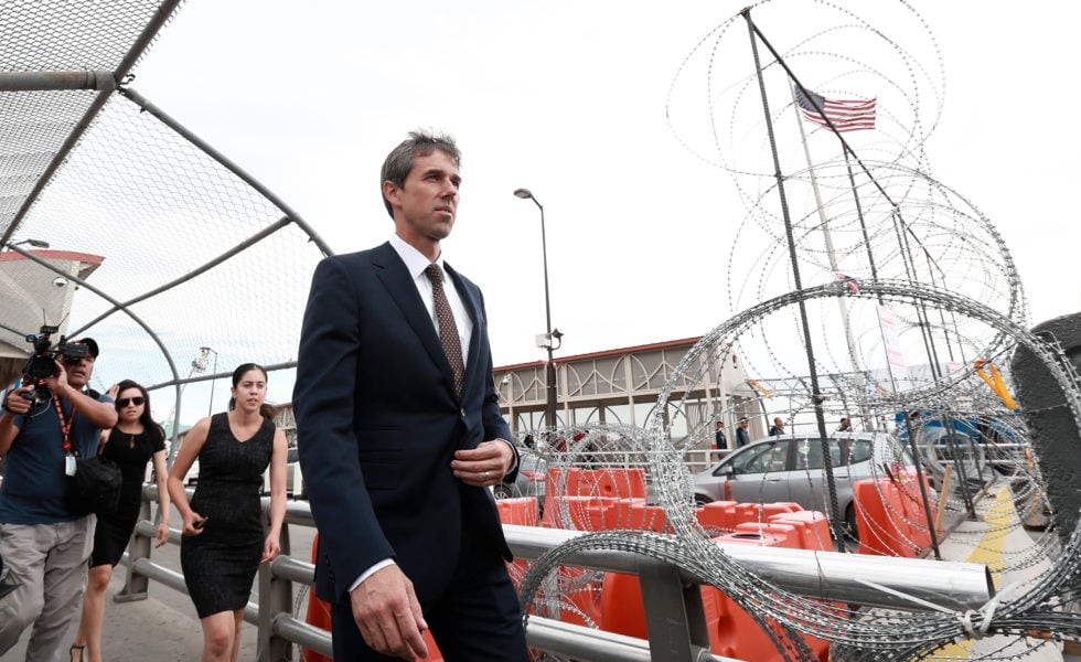 Democratic presidential candidate Beto O'Rourke walks on an international bridge to cross into Ciudad Juarez for the funeral of one of the 22 people killed in a mass shooting at a Walmart in El Paso earlier this month.