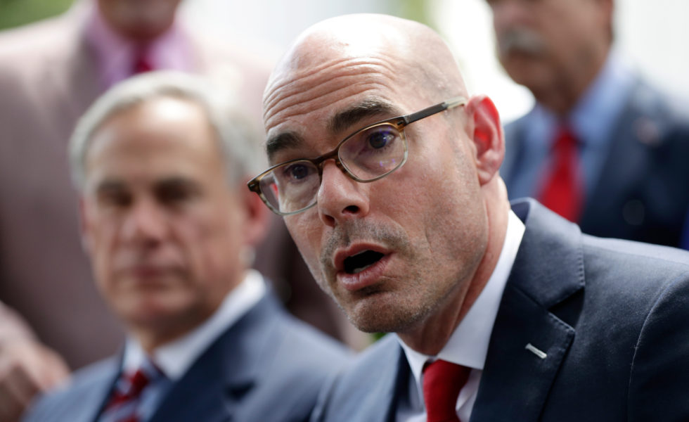 Speaker of the House Dennis Bonnen, right, with Governor Greg Abbott, left, discuss teacher pay and school finance in May 2019.