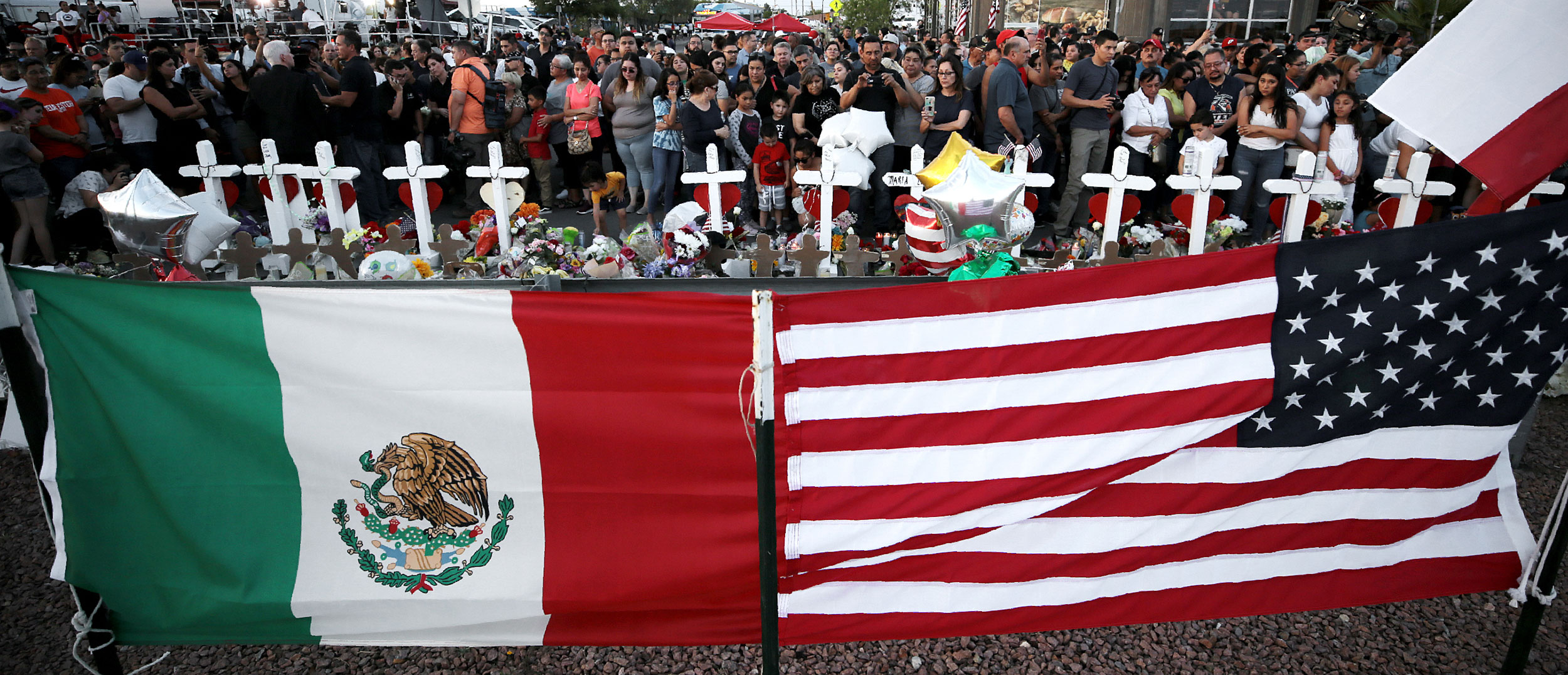 The memorial outside the Walmart in El Paso, Texas, continues to grow Monday, Aug. 5, 2019, as more El Pasoans arrive to leave flowers, pray and light a candle for the victims of the attack at Walmart on Saturday, Aug. 3, 2019, that claimed 22 lives and left 25 others injured