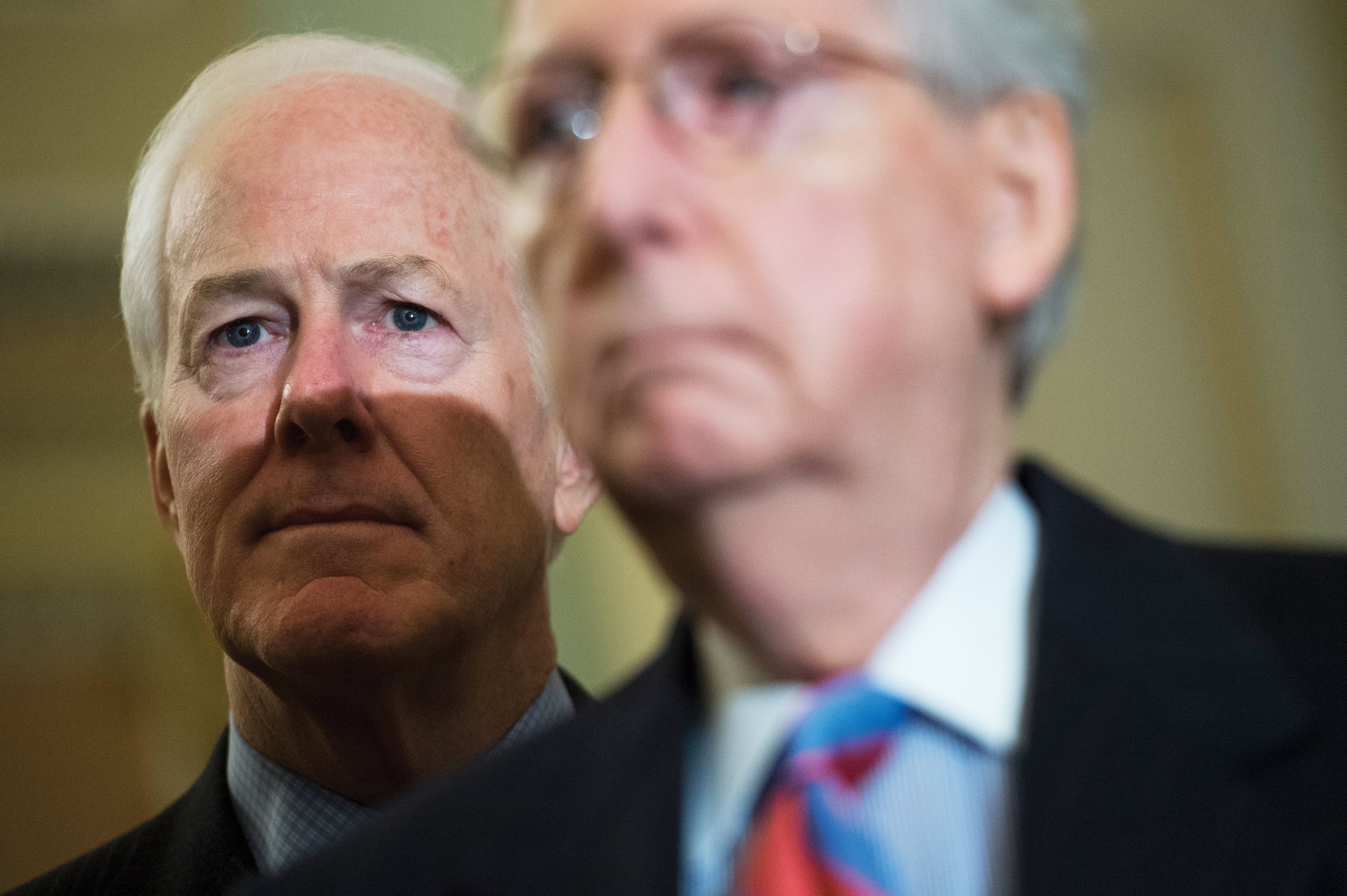 Senate Majority Whip John Cornyn, R-Texas, left, and Senate Majority Leader Mitch McConnell, R-Ky., conducts a news conference after the Senate Policy luncheons in the Capitol on March 13, 2018.