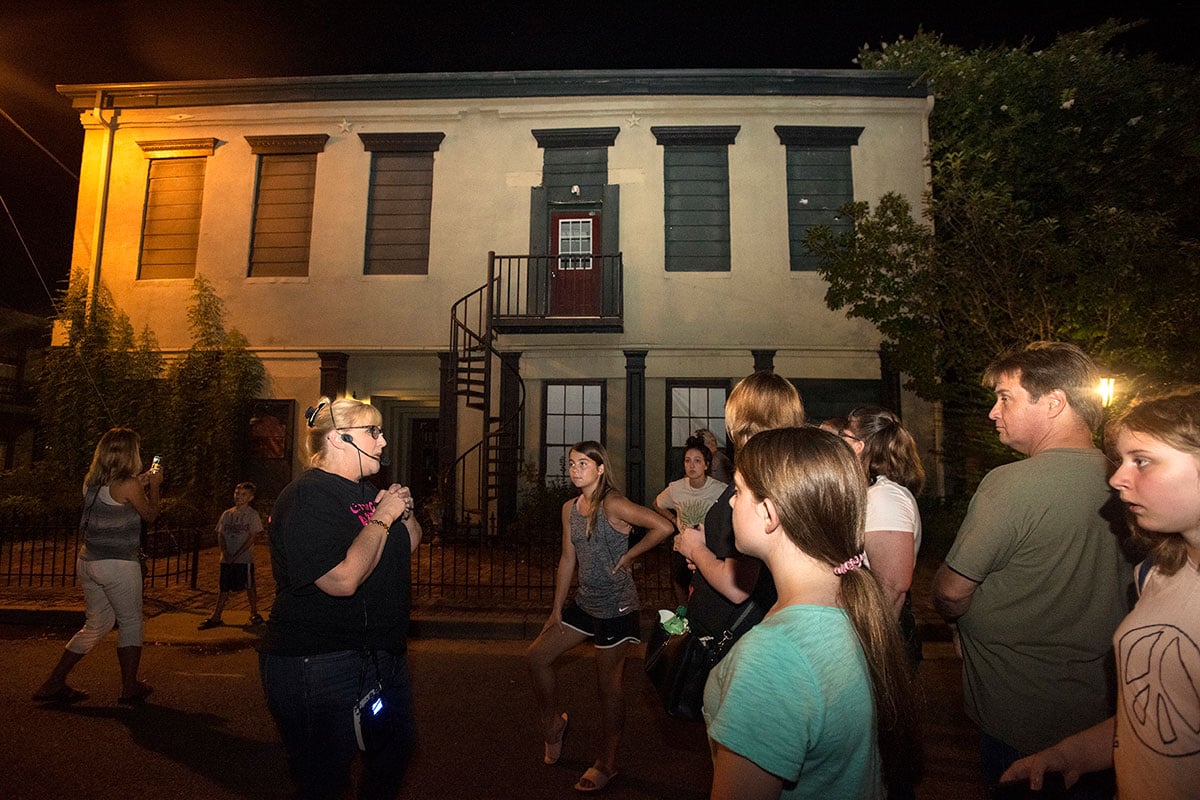 Jodi Breckenridge tells guests historical stories outside of The Jefferson Hotel on her Historical Jefferson Texas Ghost Walk Tour in downtown Jefferson on Friday July 26, 2019.