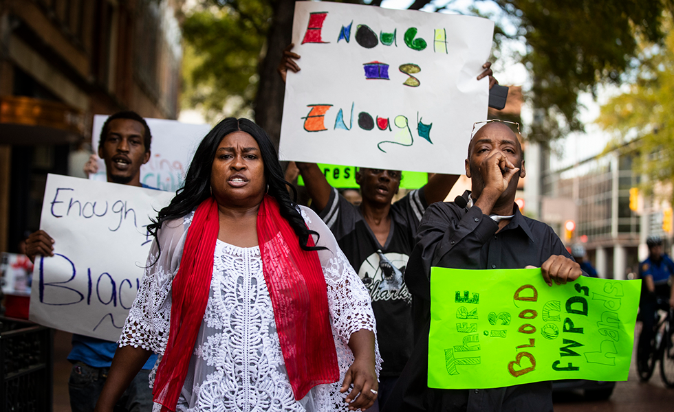 In this Tuesday, Oct. 15, 2019 photo, protesters demonstrating against the killing of Atatiana Jefferson by a white Fort Worth police officer, march down Main Street in downtown Fort Worth, Texas. (Yffy Yossifor/Star-Telegram via AP)