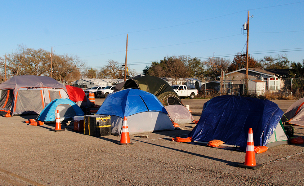 Tents toward the back of the lot at the governor's camp.