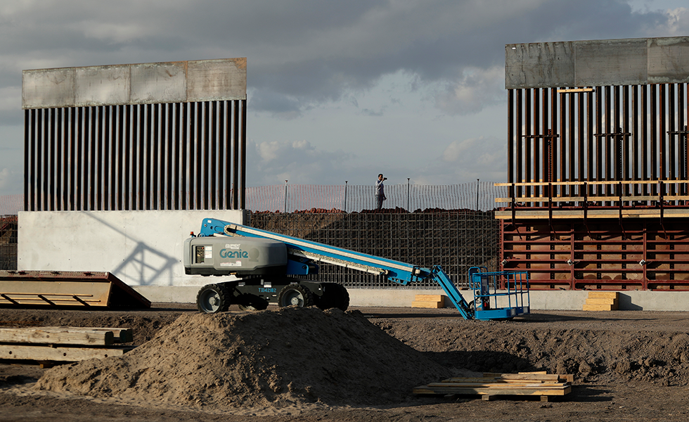 The first panels of levee border wall are seen at a construction site along the U.S.-Mexico border, Thursday, Nov. 7, 2019, in Donna, Texas. The new section, with 18-foot tall steel bollards atop a concrete wall, will stretch approximately 8 miles. (AP Photo/Eric Gay)