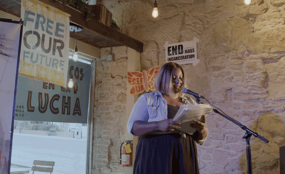 Faylita Hicks reads at an event to end mass incarceration.