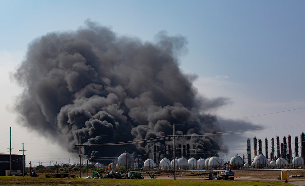 Smoke rises from an explosion at the TPC Group Port Neches Operations plant on Wednesday, Nov. 27, 2019, in Port Neches, Texas. (Marie D. De Jesus/Houston Chronicle via AP)